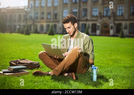 Focused young man working on his laptop Stock Photo