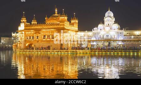 close view of the beautiful sikh golden temple at night in india Stock Photo