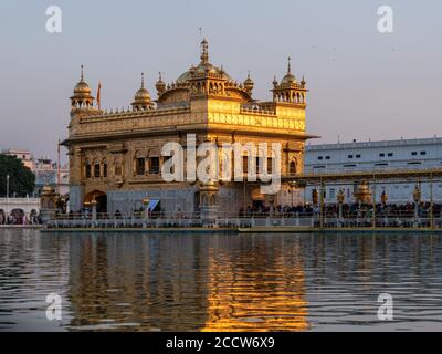 late afternoon sun shining on the beautiful golden temple in amritsar Stock Photo