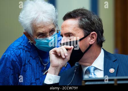 United States Representative Mark Walker (Republican of North Carolina) and US Representative Virginia Foxx (Republican of North Carolina) confer as US Postmaster General Louis DeJoy testifies during the US House Oversight and Reform Committee hearing titled “Protecting the Timely Delivery of Mail, Medicine, and Mail-in Ballots,” in Rayburn House Office Building on Monday, August 24, 2020.Credit: Tom Williams/Pool via CNP | usage worldwide Stock Photo
