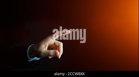 Businessman pointing finger on blurred background Stock Photo