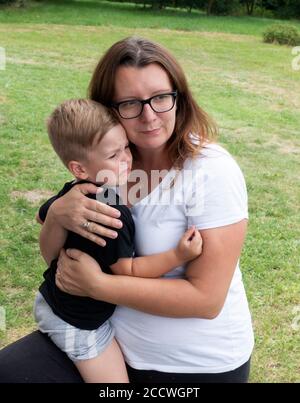 Polish mother comforting her son who is sad. Zawady Gmina Rzeczyca Poland Stock Photo