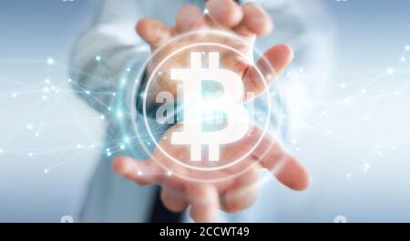 Businessman on blurred background using bitcoins cryptocurrency 3D rendering Stock Photo