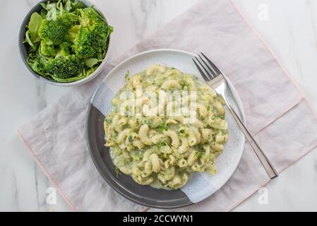 healthy home made Vegan fusilli pasta salad with broccoli Stock Photo