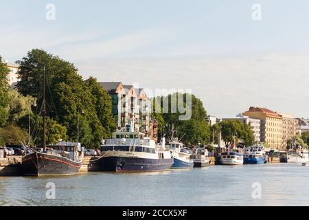 Boats by the Aurajoki river on a late summer morning in Turku Finland Stock Photo