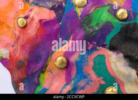 Colorful decorative marble background with gold balls. Plasticine artwork texture. Stock Photo