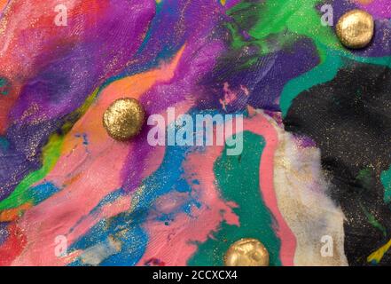 Colorful decorative marble background with gold balls. Plasticine artwork texture. Stock Photo