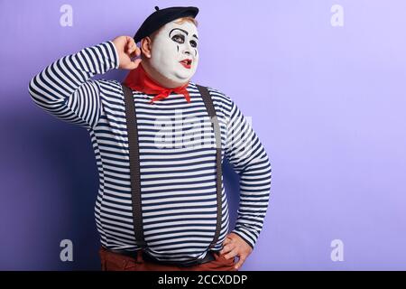 man thinking deeply about something, trying to remember information. copy space.isolated blue background Stock Photo