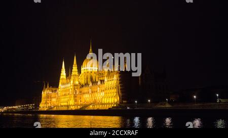Hungarian Parliament at night. Budapest, Hungary, The Danube River in the foreground Stock Photo