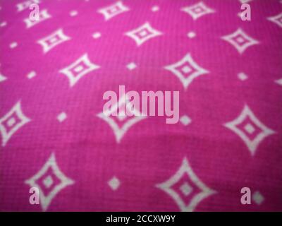 Diamond textured pink pillow cover related blur Stock Photo