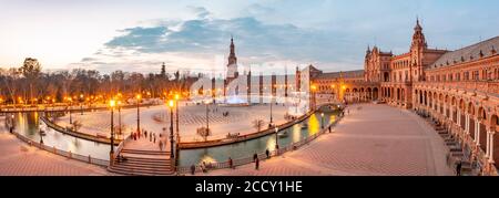 Illuminated Plaza de España at dusk, Seville, Andalusia, Spain Stock ...
