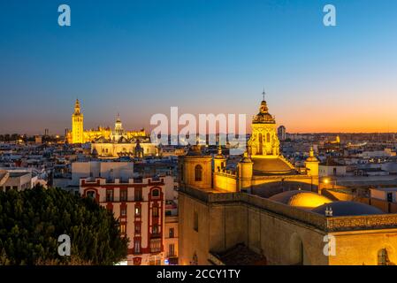 View from Metropol Parasol over the city, illuminated Cathedral of Seville with tower La Giralda, blue hour, Seville, Andalusia, Spain Stock Photo