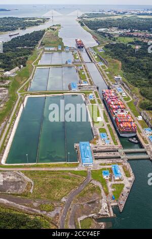 Aerial view of two Neo-Panamax container ships crossing the third set of locks at the pacific side, Panama Canal, Panama Stock Photo