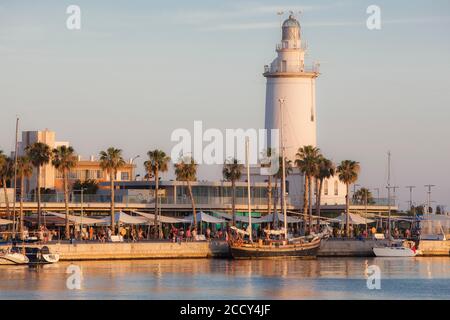 Port with lighthouse in the evening light, Malaga, Spain Stock Photo