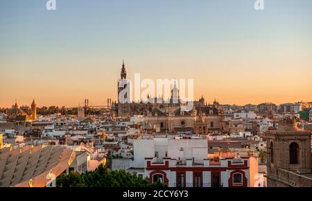 View over Sevilla, sunset, Cathedral of Sevilla with tower La Giralda, Las Setas, Metropol Parasol, curved wooden construction, Plaza de la Stock Photo