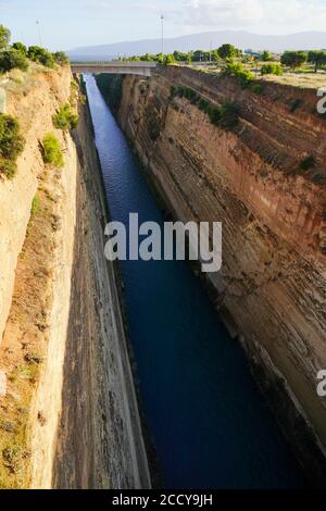 The Corinth Canal connects the Gulf of Corinth in the Ionian Sea with the Saronic Gulf in the Aegean Sea. It cuts through the narrow Isthmus of Corint Stock Photo