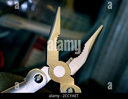 Stainless steel pliars as part of pocket multi tool. Stock Photo