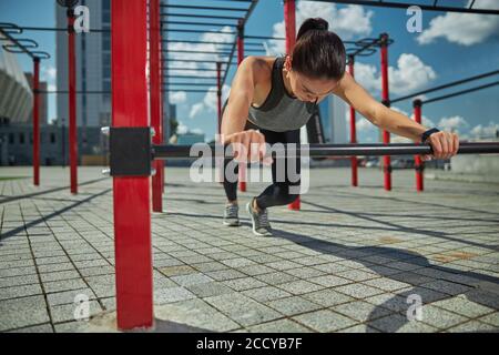 Concentrated woman being deep in thoughts during training Stock Photo