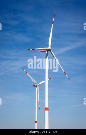 Linnich, North Rhine-Westphalia, Germany - Wind turbines against a blue sky. Stock Photo