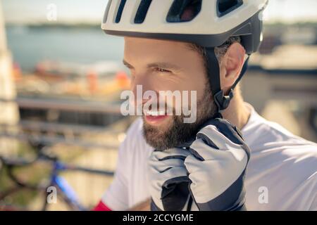 Close-up of mans head in bicycle helmet Stock Photo