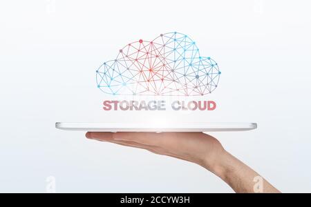 Online Data Storage. Polygonal Wireframe Cloud Over Digital Tablet In Male Hand Stock Photo