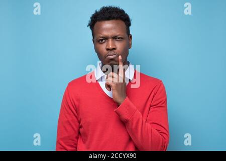 Handsome african man thinking making a plan. Stock Photo