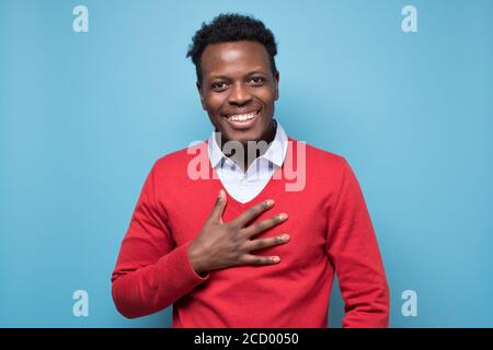 Pleased Touched African American Smiling Young Bearded Man Hold Hands 