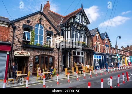 Shops, restaurants and cafes on Lark Lane, Liverpool, England, UK Stock Photo