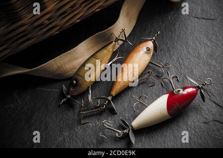 An old South Bend fishing lure, or plug, designed for catching predatory  fish photographed against the whicker lid of an old tackle box. From a  collec Stock Photo - Alamy