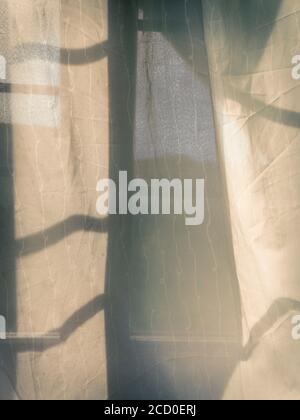 Curtains on the window. Abstract sunset background. Stock Photo