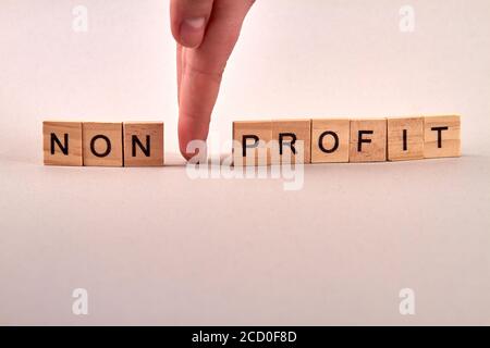 Wooden blocks with letters making non profit text. Stock Photo