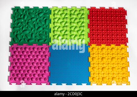 Orthopedic mats view from above. Bright colorful multicolored mats to prevent flat feet and foot massage Stock Photo