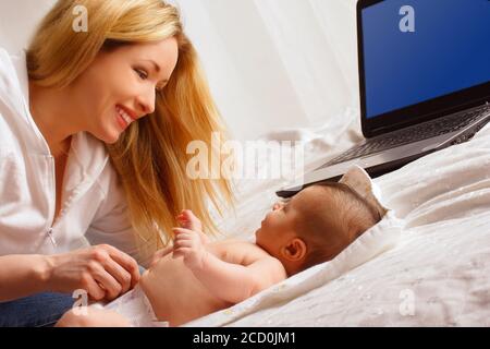 Mother And Child, Computer In Background Stock Photo
