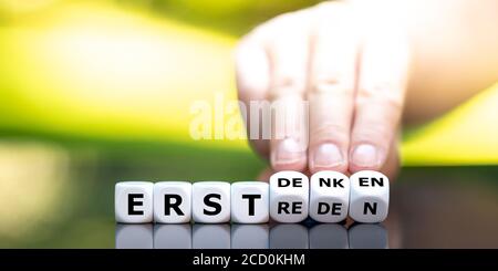 Dice form the German expression 'erst denken, dann reden' (think before you speak). Stock Photo