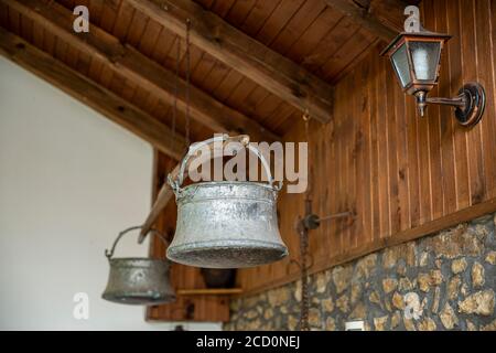 Old metal water buckets - traditional Bulgarian copper water container. Nowadays it is used for decoration. Stock Photo