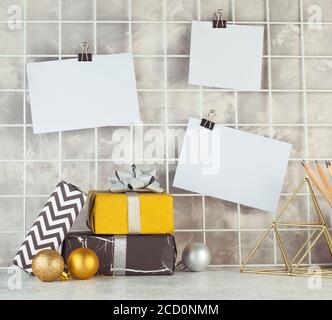 Mood board with empty cards on it near gift boxes. Blank space for text. Stock Photo