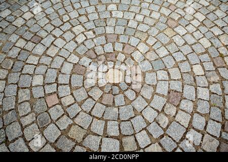 Paver bricks arranged in a circular pattern in a historic city in Bulgaria, architectural background. Stock Photo