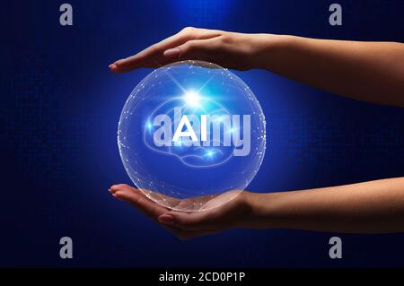 Hands holding sphere with AI inscription inside Stock Photo