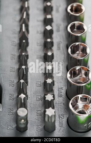 Replacement attachments and bits for repair. Tool box with various heads Stock Photo