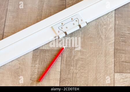 Door or window frame, hinge and pencil on a floor Stock Photo