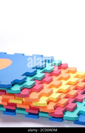 Macro photo of the details of a foam eva. Colored rubber mat puzzle for children. Stock Photo