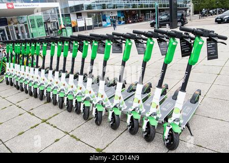 EDITORIAL USE ONLY A group of parked e-scooters as Lime launches the UK's first, full-scale e-scooter service in Milton Keynes with 500 scooters deployed, as part of a nationwide launch this year. Stock Photo
