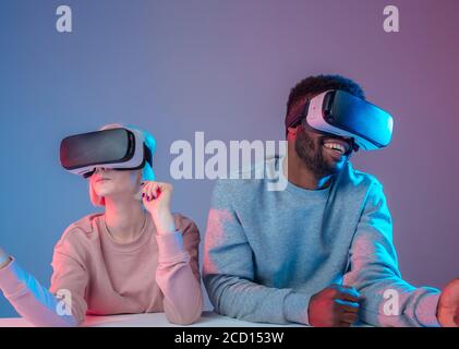 happy man and woman exploring fantastic world, close up photo, multi-projected environments, imaginary environment, happiness, happy pastime Stock Photo