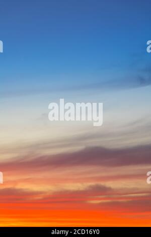 Amazing deep blue and orange colors sunset sky gradient vertical background Stock Photo