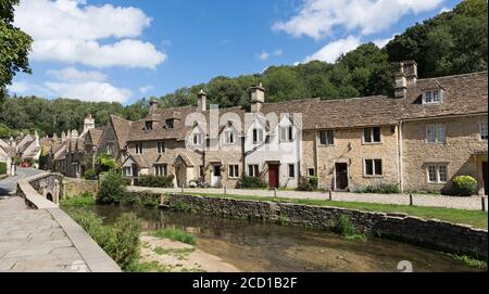 Weavers' cottages and Bybrook River, 'Castle Combe', picturesque Cotswolds village, Wiltshire, England, UK Stock Photo