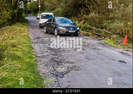 Clonely, West Cork, Ireland. 25th Aug, 2020. The Caheragh to Drimoleague road at Clonely was destroyed during major floods during Storm Francis last night. Cars negotiated the broken road at a crawl this evening. Cork County Council was on scene assessing the damage. Credit: AG News/Alamy Live News Stock Photo