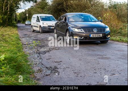 Clonely, West Cork, Ireland. 25th Aug, 2020. The Caheragh to Drimoleague road at Clonely was destroyed during major floods during Storm Francis last night. Cars negotiated the broken road at a crawl this evening. Cork County Council was on scene assessing the damage. Credit: AG News/Alamy Live News Stock Photo