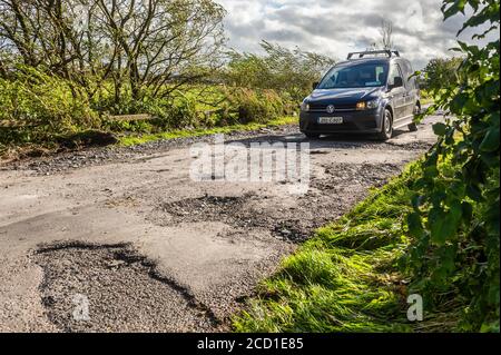 Clonely, West Cork, Ireland. 25th Aug, 2020. The Caheragh to Drimoleague road at Clonely was destroyed during major floods during Storm Francis last night. Cars negotiated the broken road at a crawl this evening. Cork County Council was on scene assessing the damage. Credit: AG News/Alamy Live News Stock Photo