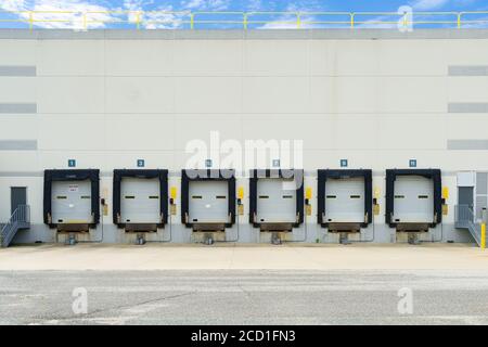 Row of empty warehouse loading docks Stock Photo