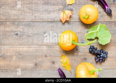 Autumn background with leaves and vegetables. Fall harvest on aged wood with copy space. top view and flat lay Stock Photo